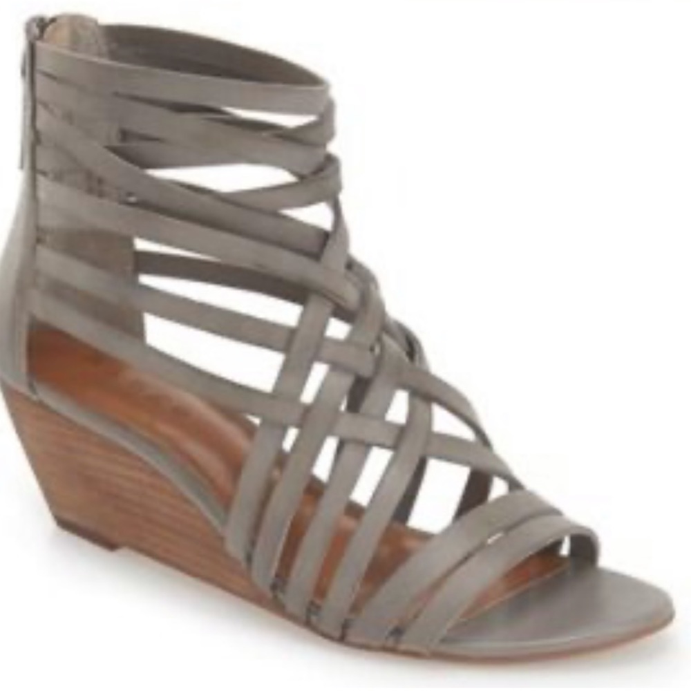 Hinge gray strappy leather wedge sandals.